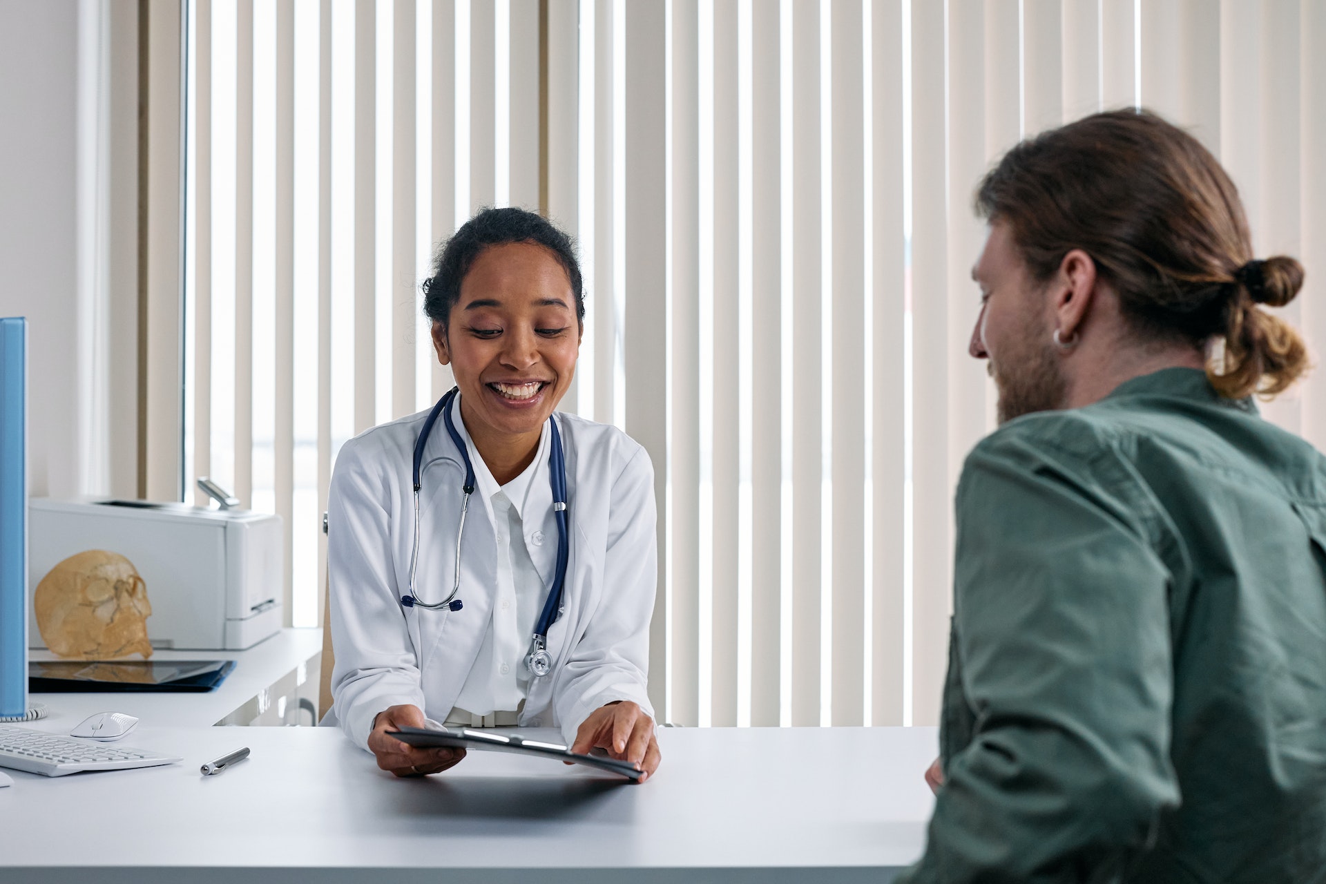 A smiling patient and doctor.