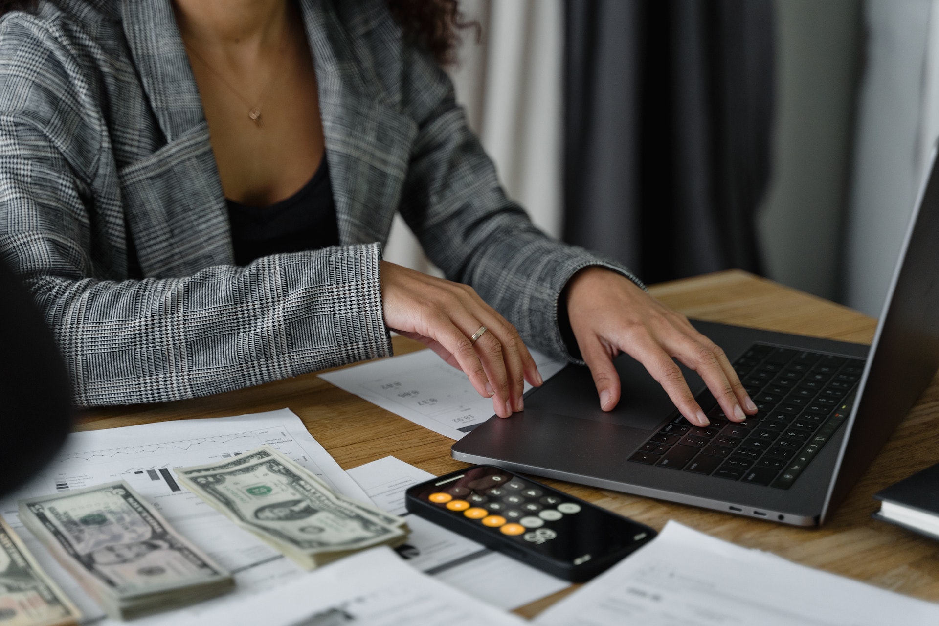 A woman managing money on her computer.